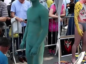 Naked Asian Lad's body is painted in public