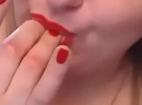 red woman masturbates and plays and cums